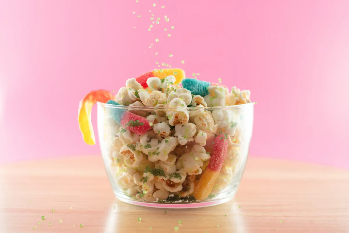 Colorful Alien Mix popcorn with gummy worms and green sprinkles