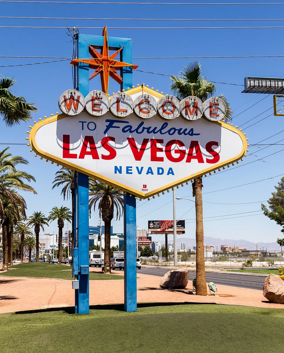 Welcome to Fabulous Las Vegas sign beneath a bright blue sky